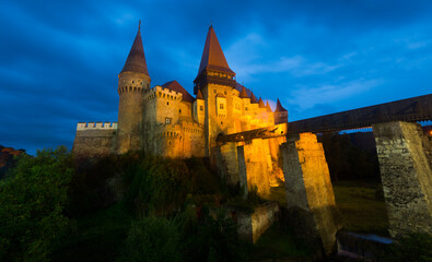 Fototapeta na wymiar View of illuminated Gothic-Renaissance Corvin Castle in night, Hunedoara, Romania