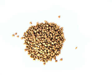 buckwheat in a pile (isolated on white background) cut out close up (kasha, healthy grain, seed, food)