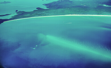 Aerial view of the Whitsunday Islands, in the Great Barrier Reef, the world's largest coral reef ...