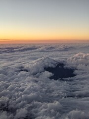 view of clouds over the mountains