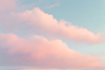 Obraz premium Dreamy sky background with scattered clouds background filled with imagination and wonder, pastel colors sky