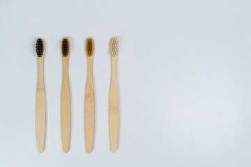 Bamboo toothbrushes on a white background. Eco products for the home.
