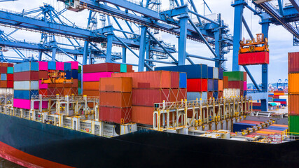 Container ship in export and import business and logistics, Container ship berthing port.