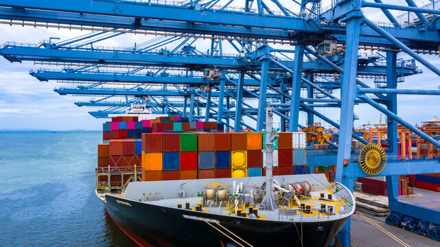 Container ship in export and import business and logistics, Container ship berthing port.