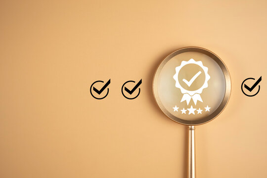 Quality guarantee and best service value concept. Warranty assurance with five stars in magnifying glass focus. High quality management of  product and certificate award, business excellence.