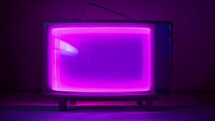 An antiquated television that sits atop a sleek metal stand. The TV s black bezel is lined with blinking neon LEDs which frame a slightly muted analog display. The