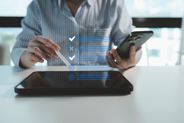 Employee is looking for information on laptop, The supervisor is making a checklist, The operator is looking at the details of the various checklists that the employee has brought.