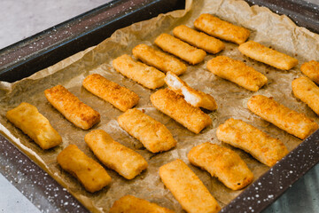 Fish sticks made from wild caught Alaskan Pollock in a crunchy golden breading close-up