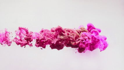 Paint drop background. Magic cloud. Vibrant dynamic captivating magenta pink liquid smoke flow abstract swirls spreading art isolated on white.