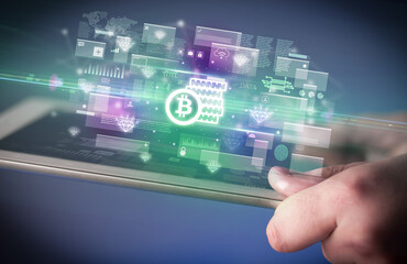 Close-up of a hand using tablet, currency concept