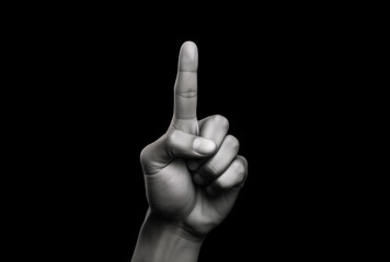 Index finger pointing upwards isolated on black