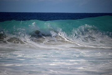 aquamarine waves crashing on the shoreline