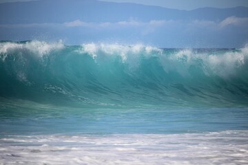 aquamarine waves crashing on the shoreline