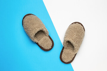 Warm slippers on a blue and white background.