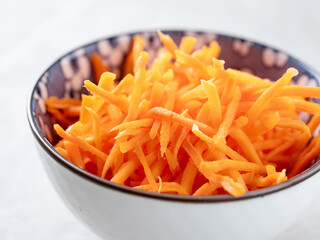 shredded carrots in a bowl