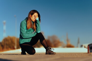 Fototapeta premium Sportive Girl Feeling Exhausted and Defeated Exercising Outside. Runner struggling with speed and breathing properly feeling tired 