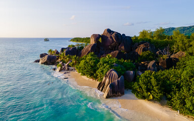 Anse Source d'Argent, La Digue Seychelles, a young couple of men and women on a tropical beach