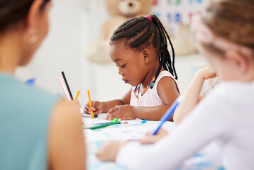 African, kid and pencil for drawing in classroom for learning, education and development of motor skills. Little girl, student on learner with serious, determination and look for creative activity - Powered by Adobe