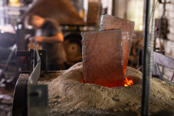 Foundry - ferrous metal is melted in an induction furnace of metallurgical plant