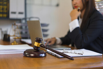 Legislation and justice concept, Young female lawyer working in law office with judgment hammer