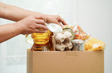 Foodstuffs in donation box for volunteer to help people.