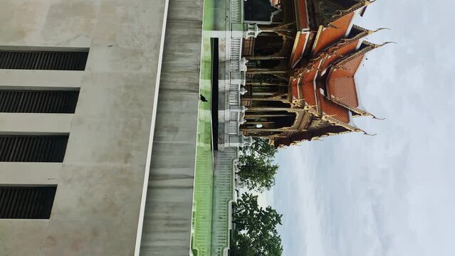 vertical pano of buddhist thai temple in Bangkok city center 