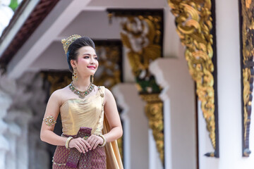 Asian Young Woman, Portrait of a beautiful Thai girl wearing an Elegant Thai dress costume...