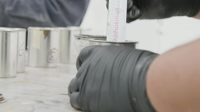 men mixing and revolving paint