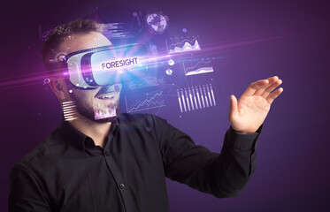 Businessman looking through Virtual Reality glasses