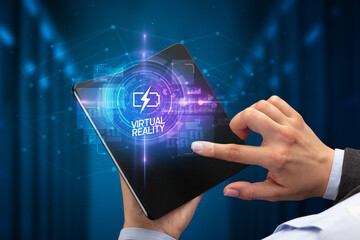 Businessman holding a foldable smartphone, technology concept