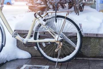 Zelfklevend Fotobehang Vintage Bike with snow in winter season. Sapporo, Hokkaido, Japan © Jo Panuwat D