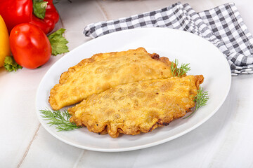Homemade fried cheburek with meat