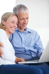 Mature couple, laptop and video call with smile, conversation and living room couch. Social media, technology and communication with family, man and woman with connection, streaming and happy