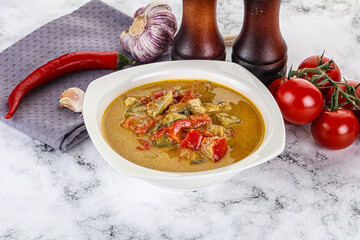 Traditional yellow Thai curry with chicken