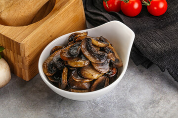 Roasted champignon mushrooms in the bowl