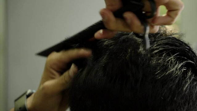 groom hair cutting in salon