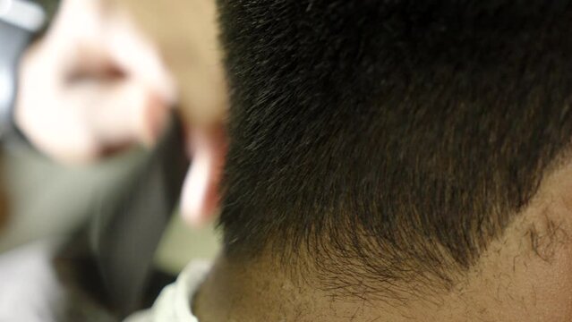 groom hair cutting in salon