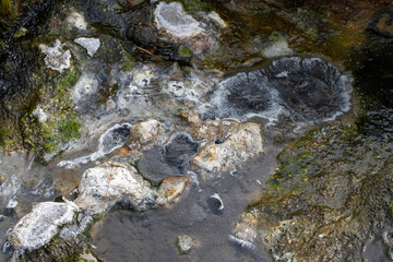 Top view of the ground surface near geothermal sources. Close-up. Natural background.