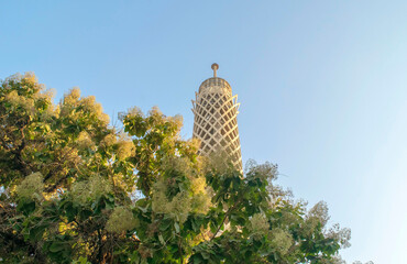 Cairo Tower surrounded by foliage, a television tower in the modern district of Zamalek