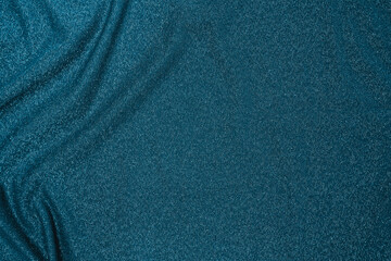 Trendy 80s, 90s, 2000s Background of draped dark green fabric with silver lurex thread. Beautiful...