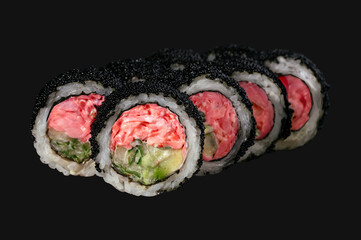 Asian food, sushi with sesame, salmon and cream cheese inside