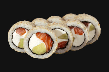 Japanese food rolls isolated on a black background