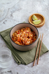 fried japanese rice with chicken and vegetables, hot sauce
