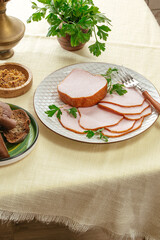 sliced ham in a plate on the table