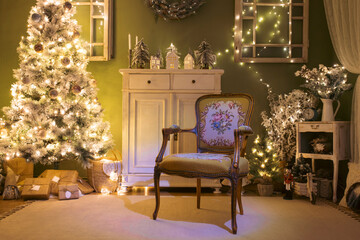 Beautiful holdiay decorated room with Christmas tree with presents under it