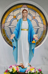 Close up of Statue of Our lady of grace virgin Mary in the church, Thailand. selective focus.