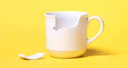 Broken cup isolated on a solid background