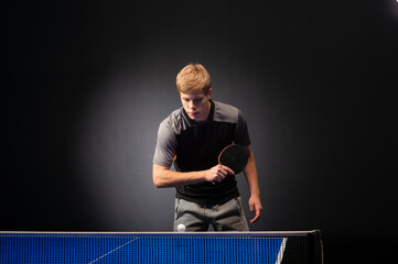 Portrait of young man playing tennis