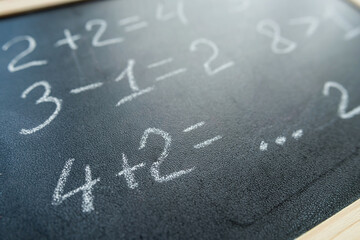 primary learn mathematical solved example on a chalkboard - obrazy, fototapety, plakaty