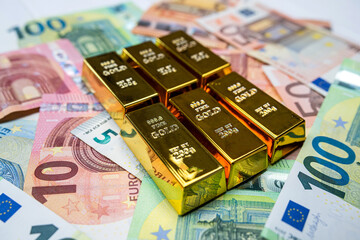 Business and saving concept euro money with gold bars